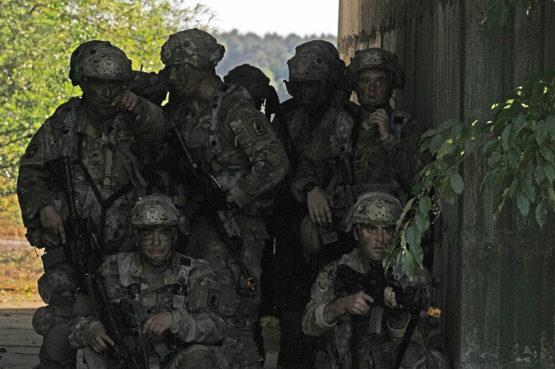 Soldiers prepare to assault their designated objective during a forcible-entry exercise.