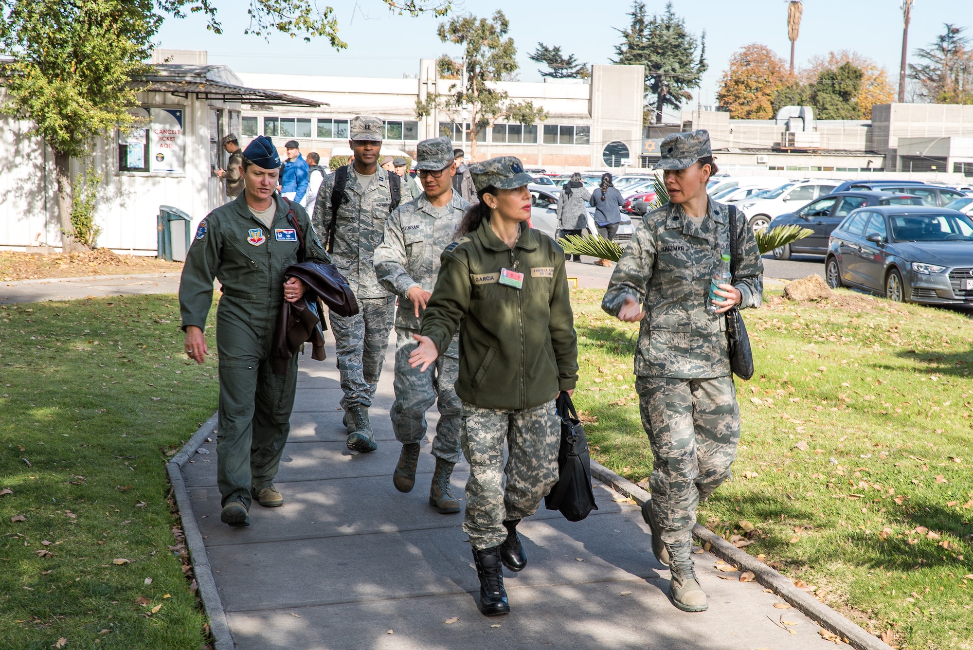 U.S. and Chilean air force medical personnel walk through Chilean Air Force hospital grounds during a health services administration subject matter expert exchange with the Chilean Air Force at the Hospital Clínico, Santiago, June 4-8. Key U.S. and Chilean air force military health specialists discussed ways to improve medical administration practices, marking the first time this type of exchange has taken place in Chile. (U.S. Air Force photo by Staff Sgt. Danny Rangel)