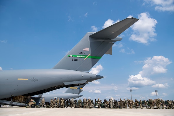 U.S. Army paratroopers assigned to the 82nd Airborne Division, Fort Bragg, N.C., and British Army paratroopers assigned to the 3rd Regiment Parachute Battalion C. Company, Colchester, England, board a C-17 Globemaster III at Pope Army Air Field, N.C., during Exercise Swift Response 18 (SR18) June 8, 2018. SR18 is one of the premier military crisis response training events for multinational airborne forces in the world that demonstrates the ability of America's Global Response Force to work hand-in-hand with joint and total force partners. (U.S. Air Force photo by Airman First Class Gracie I. Lee)