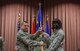 Col. David Williams, passes the guidon to Maj. Francine Kwarteng as she assumes command of the 39th Logistics Readiness Squadron.