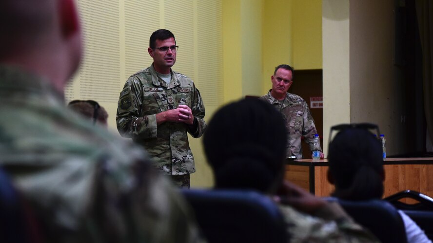 Chief Master Sgt. Chad Welch, 386th Air Expeditionary Wing command chief, speaks during an enlisted all-call, held June 12, 2018, at an undisclosed location in Southwest Asia. The command chief succeeded Chief Master Sgt. Timothy Pachasa and hails from Scott Air Force Base, Ill. (U.S. Air Force photo by Staff Sgt. Christopher Stoltz)