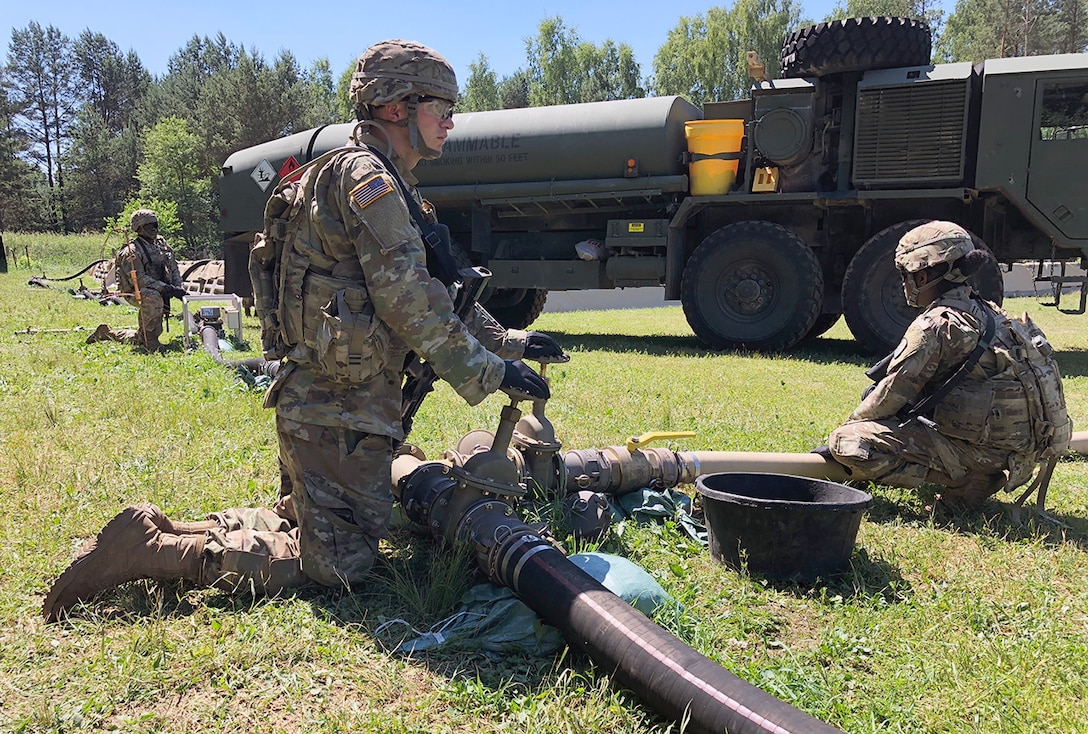 Soldiers with the 240th Composite Supply Company monitor a fuel pump pushing DLA-managed gas in Drawsko Pomorskie, Poland, during Saber Strike 2018. DLA is supporting the U.S. Army, Europe-led exercise taking place in Estonia, Latvia, Lithuania and Poland June 3-15. Photo by Nutan Chada
