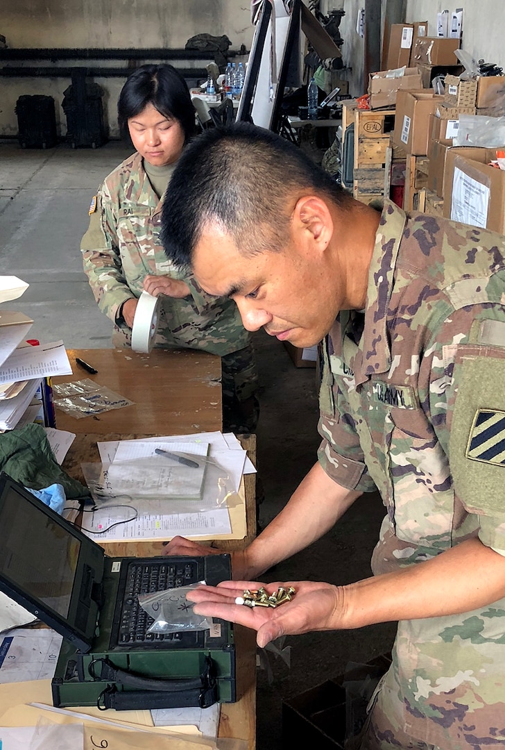 A soldier with the 26th Composite Supply Command counts parts provided by DLA during Saber Strike 2018 in Powidz, Poland. DLA is supporting the U.S. Army, Europe-led exercise taking place in Estonia, Latvia, Lithuania and Poland June 3-15. Photo by Nutan Chada