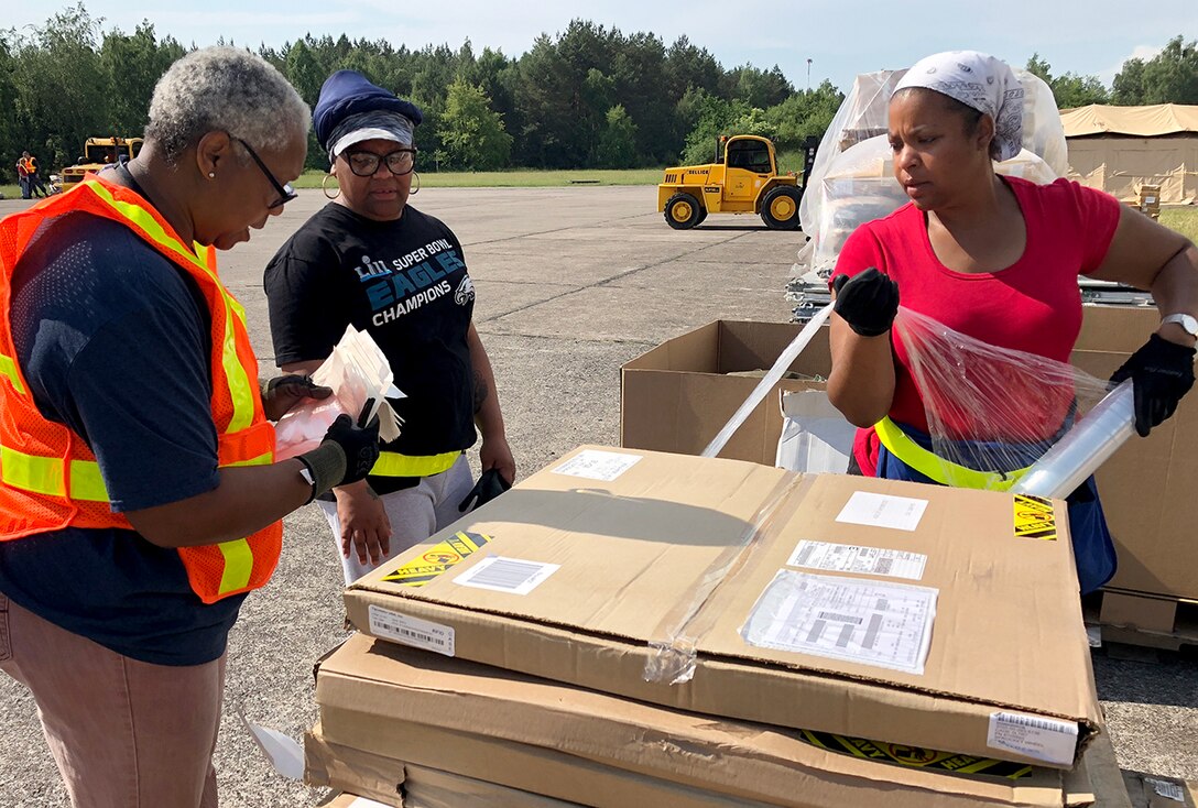Members of DLA Distribution Depot Powidz, Poland, wrap a pallet of supplies destined for customers at a remote training for Saber Strike 2018. DLA is supporting the U.S. Army, Europe-led exercise taking place in Estonia, Latvia, Lithuania and Poland June 3-15. Photo by Nutan Chada