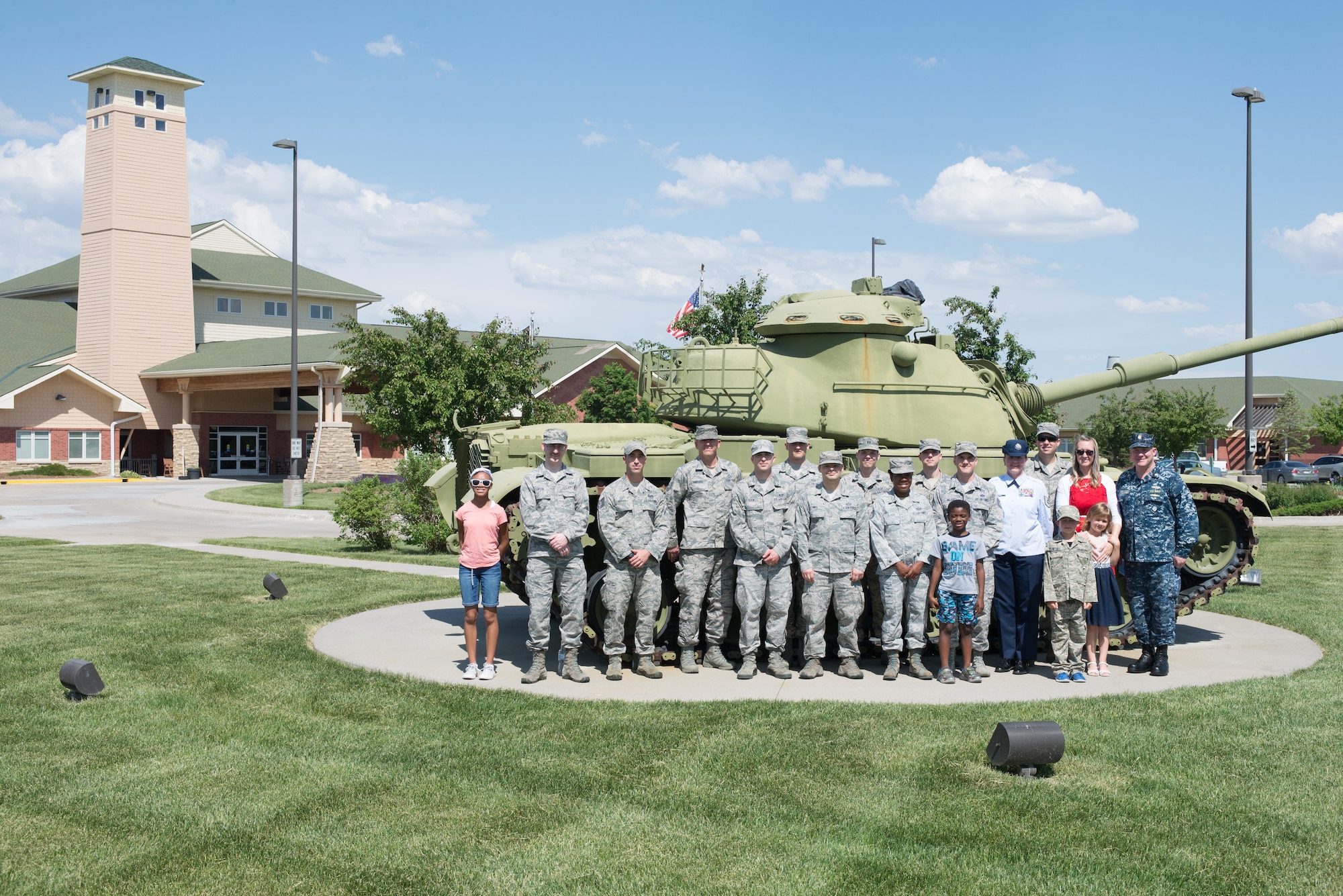 Airmen and family members from the 557th Weather Wing pose for a group photo in front of the Eastern Nebraska Veterans’ Home May 28, 2018, Bellevue, Nebraska. The group volunteered to assist the ENVH in hosting their Memorial Day ceremony. (U.S. Air Force photo by Paul Shirk)