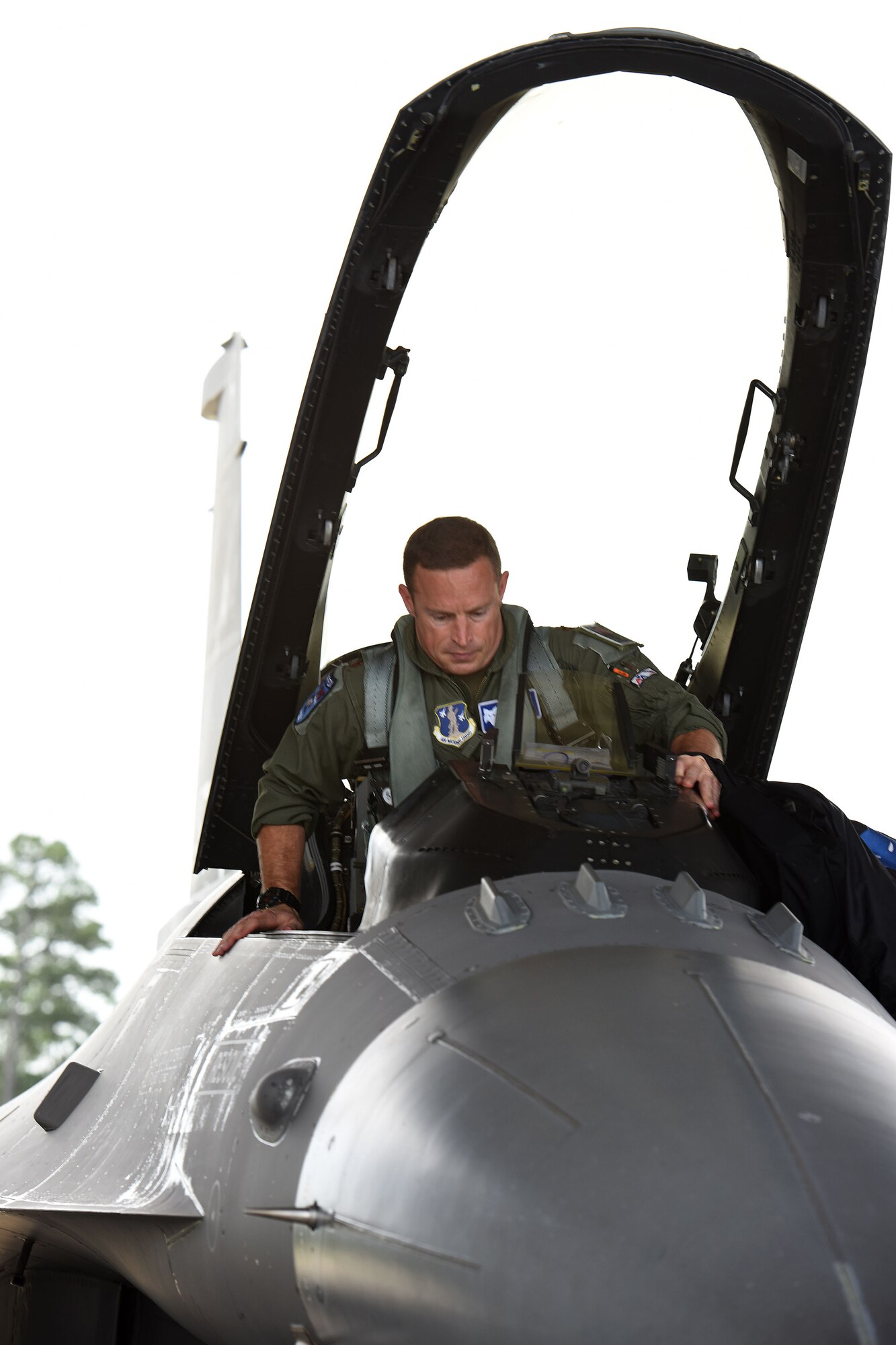 U.S. Air Force Maj. Justin Dumais, a pilot from the 169th Fighter Wing, enters the cockpit of his F-16C in preparation for an Aerospace Control Alert training mission, June 5, during the Southeast Aerospace Control Alert Conference at McEntire Joint National Guard Base, S.C. June 5-7. The 169th Fighter Wing hosted the conference in close coordination with the Continental U.S. North American Aerospace Defense Command Region, the Eastern Air Defense Sector and the Federal Aviation Administration. The conference was a total-team training initiative to improve homeland defense capabilities by developing techniques with joint forces during small-scale exercises. This conference consisted of South Carolina Air National Guard 169th FW F-16 fighter jets, U.S. Coast Guard Rotary Wing Air Intercept Squadron MH-65D Dolphin helicopters from USCG Air Station Atlantic City and South Carolina Wing Civil Air Patrol aircraft and crews to hone their skills with tactical-level air-intercept procedures. (U.S. Air National Guard photo by Senior Master Sgt. Edward Snyder)