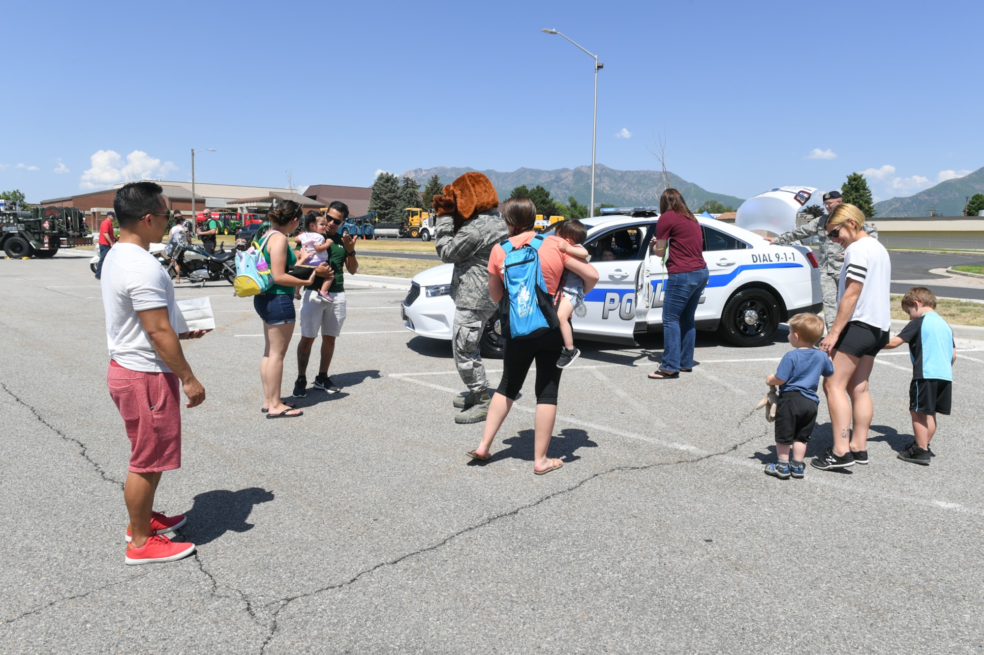 Visitors interact with 75th Security Forces and view one of their vehicles during Wheels of Wonder June 8, 2018, at Hill Air Force Base, Utah. Wheels of Wonder provides base families a fun, hands-on experience exploring various types of vehicles.