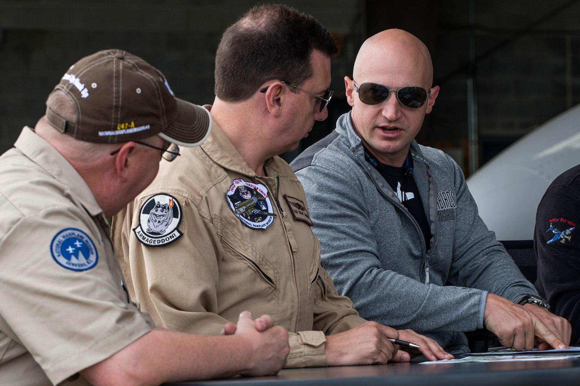 Pilots participating in a Heritage Flight hold a pre-flight briefing prior to takeoff on June 7, 2018, Niagara Falls International Airport, N.Y. The Air Force Heritage Flight Foundation provides dramatic flying displays to the entire world, pairing modern aircraft performances with fighter aircraft from the WWII, Korea and Vietnam eras. (U.S. Air Force photo by Master Sgt. Greg Steele/Released)