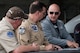 Pilots participating in a Heritage Flight hold a pre-flight briefing prior to takeoff on June 7, 2018, Niagara Falls International Airport, N.Y. The Air Force Heritage Flight Foundation provides dramatic flying displays to the entire world, pairing modern aircraft performances with fighter aircraft from the WWII, Korea and Vietnam eras. (U.S. Air Force photo by Master Sgt. Greg Steele/Released)