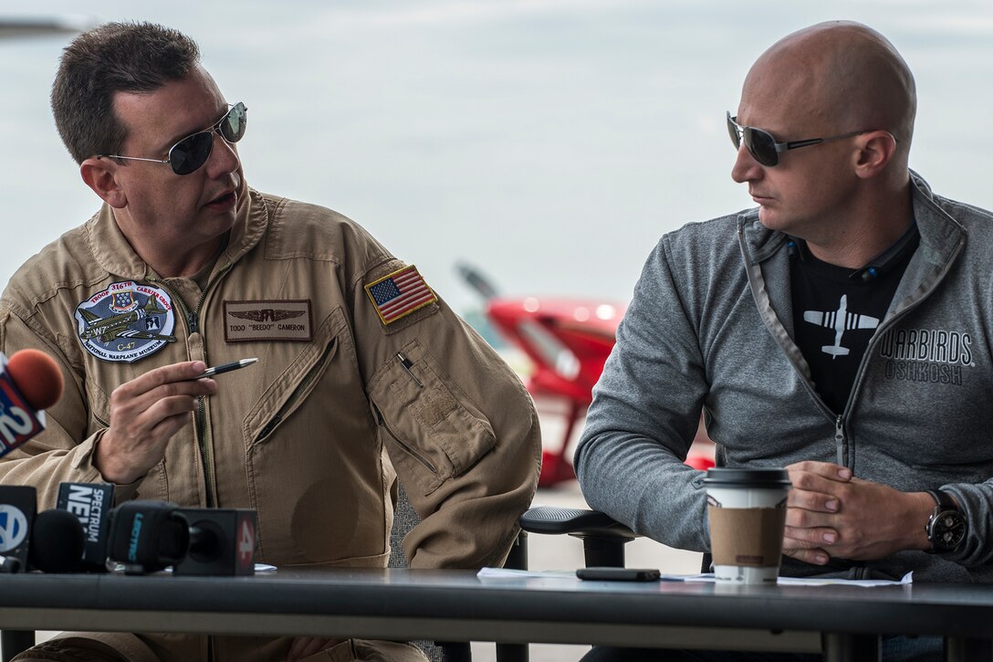 Todd Cameron, C-47 pilot, and Scott Yoak, P-51 Mustang pilot, hold a pre-flight briefing prior to their Heritage Flight on June 7, 2018, Niagara Falls International Airport, N.Y. The Air Force Heritage Flight Foundation provides dramatic flying displays to the entire world, pairing modern aircraft performances with fighter aircraft from the WWII, Korea and Vietnam eras. (U.S. Air Force photo by Master Sgt. Greg Steele/Released)