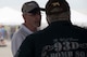 An air show spectator talks to a U.S. Air Force aircrew member assigned to the 93rd Bomb Squadron about the B-52 Stratofortress during the 2018 Thunder of Niagara International Air Show, June 09, 2018, at Niagara Falls Air Reserve Station, N.Y. The air show commemorates the Air Force Reserve 70th Anniversary and highlights the capability of men and women who serve and have served. (U.S. Air Force Photo by Staff Sgt. Callie Ware)