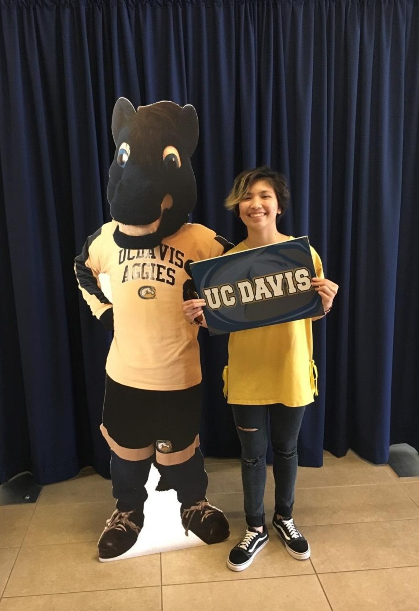 Corvias Foundation scholarship recipient, Zoexenita Mercado of Desert High School on Edwards Air Force Base, poses for a photo with at University of California, Davis mascot cutout. She plans to attend the university and be a surgeon in the future. (Courtesy photo)