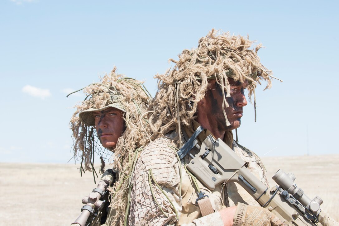 Two Idaho Army National Guard snipers conduct reconnaissance at the Orchard Combat Training Center, Boise, Idaho.