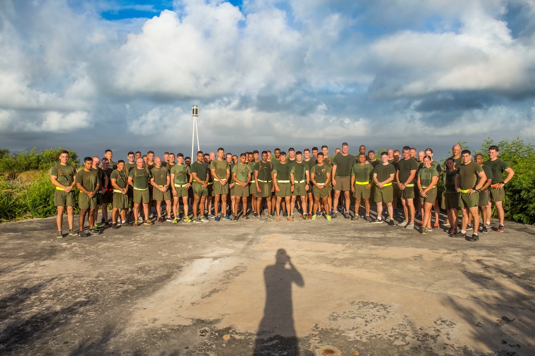 U.S. Marine Corps Lt. Col. Benjamin Harrison, commanding officer, 1st Battalion, 12th Marine Regiment, poses with staff noncommissioned officers and officers with the battalion at the top of ‘snipers nest,’ Marine Corps Base Hawaii, June, 14, 2018. Lt. Col. Harrison ran with the leadership of the battalion for the last time before he relinquishes his command on June 15, 2018. (U.S. Marine Corps photo by Sgt. Zachary Orr)