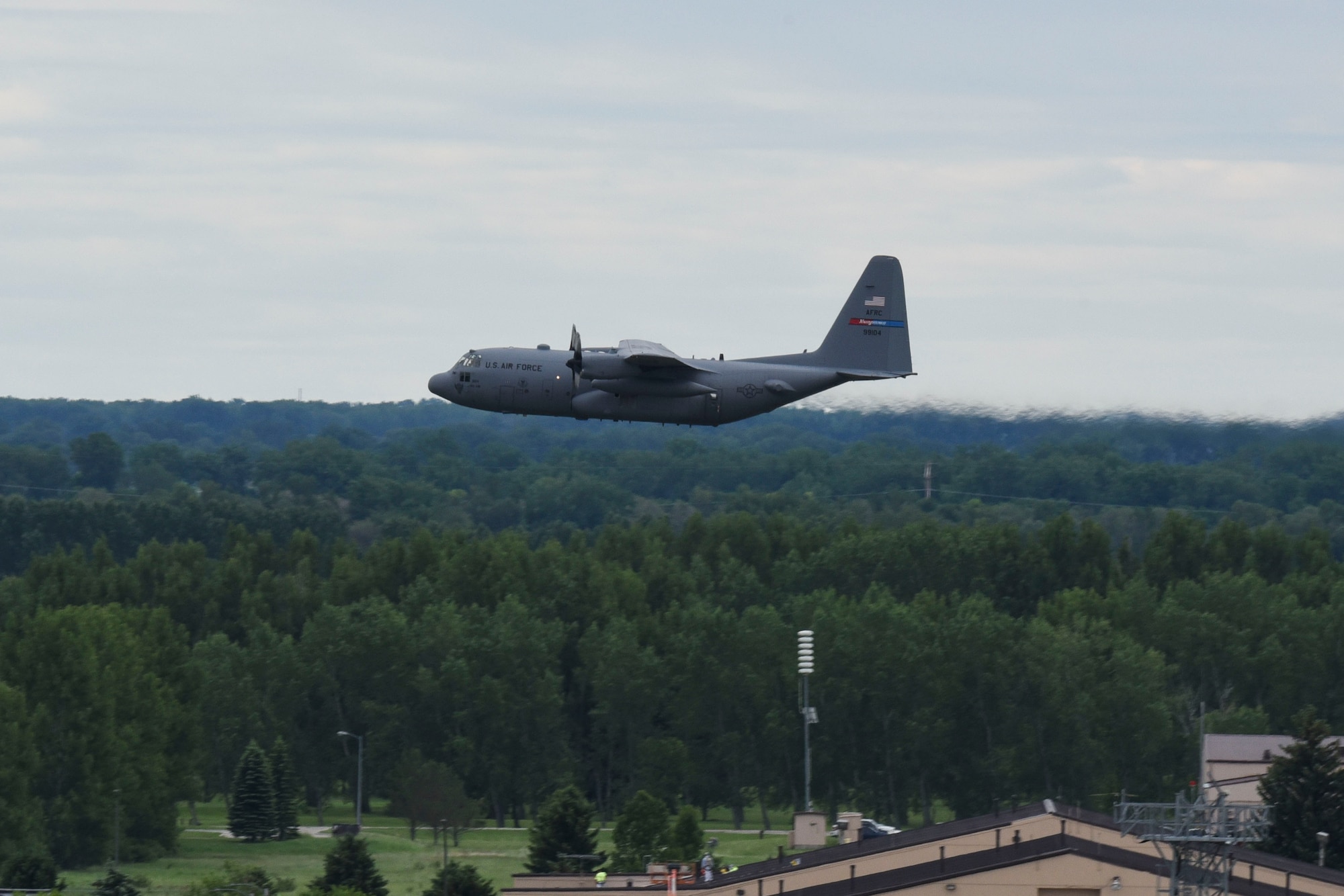 A C-130 Hercules assigned to Youngstown Air Reserve Station, Ohio, flies above Grand Forks Air Force Base, North Dakota, June 12, 2018. While the C-130 is capable of operating in remote locations around the world, this particular mission focused on controlling the number of mosquitos through the use of an aerial spray. (U.S. Air Force photo by Airman 1st Class Melody Wolff)