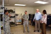 U.S. Air Force Tech. Sgt. Christopher Henry IV, 316th Training Squadron military training leader flight chief, shows Chief Master Sgt. Luis Reyes, the Army & Air Force Exchange Service’s senior enlisted advisor, the Airmen’s Attic, a place for individuals to donate or pick up free military uniforms, in the 315th Training Squadron on Goodfellow Air Force Base, Texas, June 14, 2018. Reyes met with instructors and trainees to learn more about the needs of AAFES’s customers. (U.S. Air Force photo by Staff Sgt. Joshua Edwards/Released)