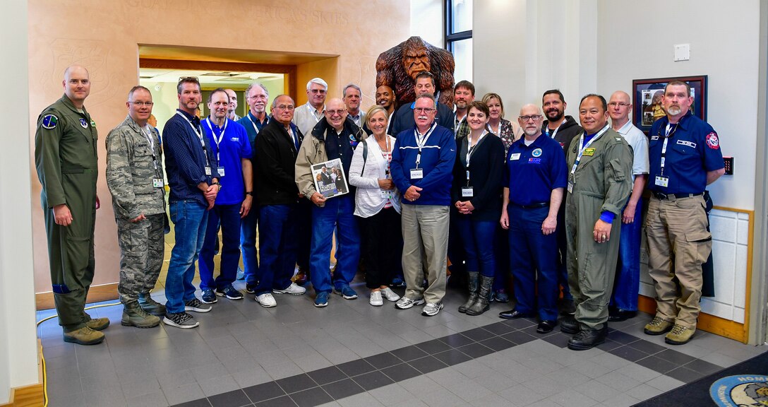 As part of the Employer Support of the Guard and Reserve (ESGR) Bosslift program, civilian employers pose in front of the Washington Air National Guard's Western Air Defense Sector mascot, Bigfoot, prior to their tour of the WADS June 6, 2018.  (U.S. Air National Guard photo by Capt. Colette Muller)