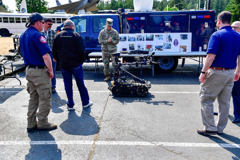 As part of the Employer Support of the Guard and Reserve (ESGR) Bosslift program, civilian employers talk with the Washington National Guard's 10th Civil Support Team about their specialzied equipment that is used to identify and assess suspected weapons of mass destruction hazards June 6, 2018.  (U.S. Air National Guard photo by Capt. Colette Muller)