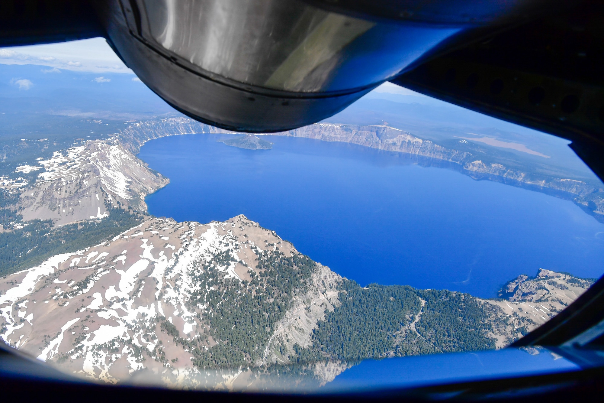 As part of the Employer Support of the Guard and Reserve (ESGR) Bosslift program, the Washington Air National Guard's 141st Air Refueling Wing flew civilian employers on KC-135s where they witnessed F-15s from the 142nd Fighter Wing, Oregon Air National Guard, being refueled June 7, 2018.  The flight path took them over Crater Lake National Park, Oregon, June 7, 2018. (U.S. Air National Guard photo by Capt. Colette Muller)