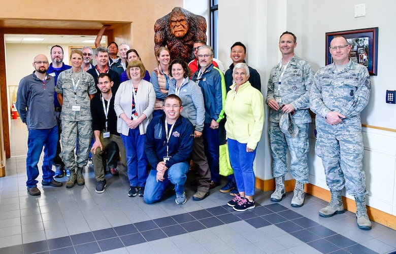 As part of the Employer Support of the Guard and Reserve (ESGR) Bosslift program, civilian employers pose in front of the Washington Air National Guard's Western Air Defense Sector mascot, Bigfoot, prior to their tour of the WADS June 7, 2018.  (U.S. Air National Guard photo by Capt. Colette Muller)