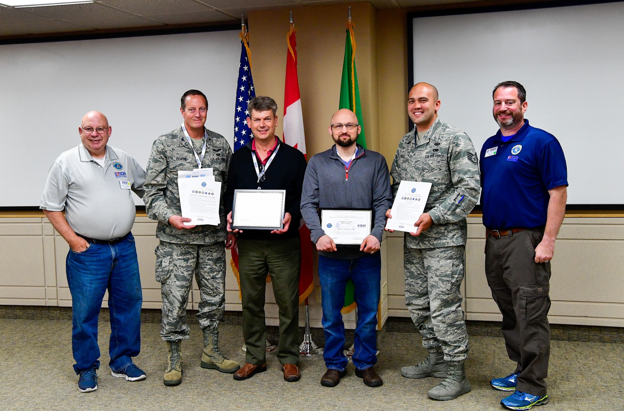 As part of the Employer Support of the Guard and Reserve (ESGR) Bosslift program, two civilian employers are recognized for their extraordinary support of their employees serving in the Guard.  Stephen Carroll, general manager for Olive Garden (third from right), was nominated by Staff Sgt. David Bauld, 225th Support Squadron, Western Air Defense Sector.  Mark Miller, managing attorney for Farmers Insurance Group (third from left), was nominated by Col. Jeffrey Coats, a military lawyer (JAG) with Headquarters Washington Air National Guard June 7, 2018.  (U.S. Air National Guard photo by Capt. Colette Muller)