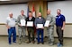 As part of the Employer Support of the Guard and Reserve (ESGR) Bosslift program, two civilian employers are recognized for their extraordinary support of their employees serving in the Guard.  Stephen Carroll, general manager for Olive Garden (third from right), was nominated by Staff Sgt. David Bauld, 225th Support Squadron, Western Air Defense Sector.  Mark Miller, managing attorney for Farmers Insurance Group (third from left), was nominated by Col. Jeffrey Coats, a military lawyer (JAG) with Headquarters Washington Air National Guard June 7, 2018.  (U.S. Air National Guard photo by Capt. Colette Muller)