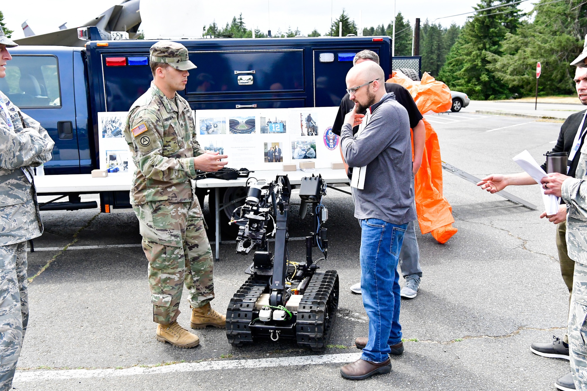 As part of the Employer Support of the Guard and Reserve (ESGR) Bosslift program, civilian employers talk with the Washington National Guard's 10th Civil Support Team about their specialized equipment that is used to identify and assess suspected weapons of mass destruction hazards June 7, 2018.  (U.S. Air National Guard photo by Capt. Colette Muller)