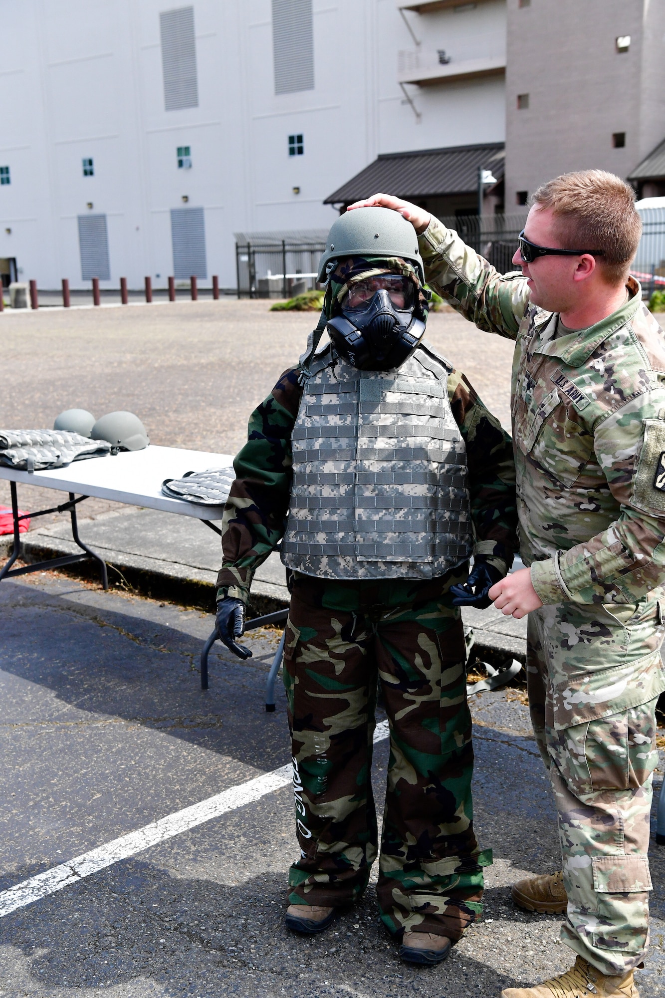 As part of the Employer Support of the Guard and Reserve (ESGR) Bosslift program, civilian employers suit up in mission oriented protective posture (MOPP) gear that is used during chemical, biological, radiological, or nuclear (CBRN) strike.  In addition, kevlar protective body armor and helmets are added over the MOPP gear June 7, 2018.  (U.S. Air National Guard photo by Capt. Colette Muller)