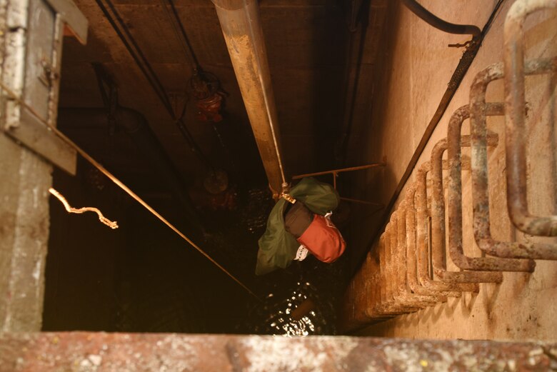 A simulated victim, a newly acquired training dummy, dangles in a confined space June 14, 2018 at Old Hickory Hydropower Plant in Hendersonville, Tenn. Recognizing the importance of “taking care of people,” U.S. Army Corps of Engineers Nashville District leadership has been focusing needed resources for train-the-trainer courses that made it possible to provide in-house training for employees who work in confined spaces. (USACE photo by Lee Roberts)