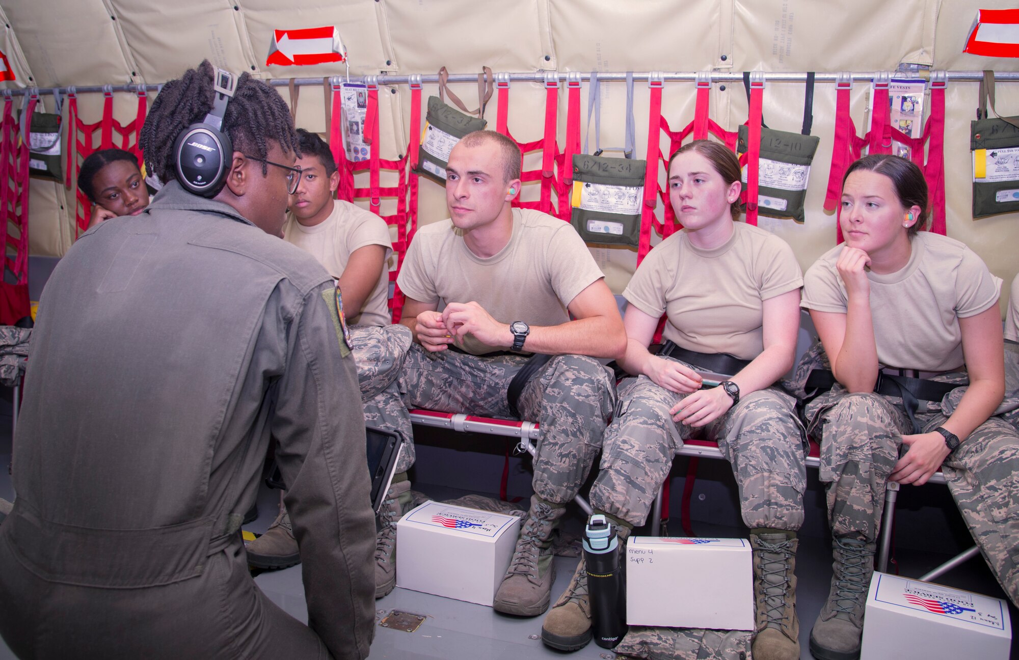 U.S. Air Force Airman 1st Class Dejahnay Fort, a boom operator assigned to the 91st Air Refueling Squadron, briefs Reserve Officer Training Corps (ROTC) cadets on what to expect during a KC-135 Stratotanker aircraft refueling flight at MacDill Air Force Base, Fla., June 14, 2018.