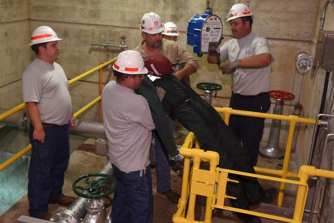 Employees at Old Hickory Hydropower Plant take part in a simulated exercise to extract a training dummy from a confined space during a Confined Space and Confined Space Rescue Course June 14, 2018 in Hendersonville, Tenn. The U.S. Army Corps of Engineers Nashville District trained 32 employees to lead the in-house training in March 2017, which will benefit more than 200 employees across the district who require the annual training. (USACE photo by Lee Roberts)