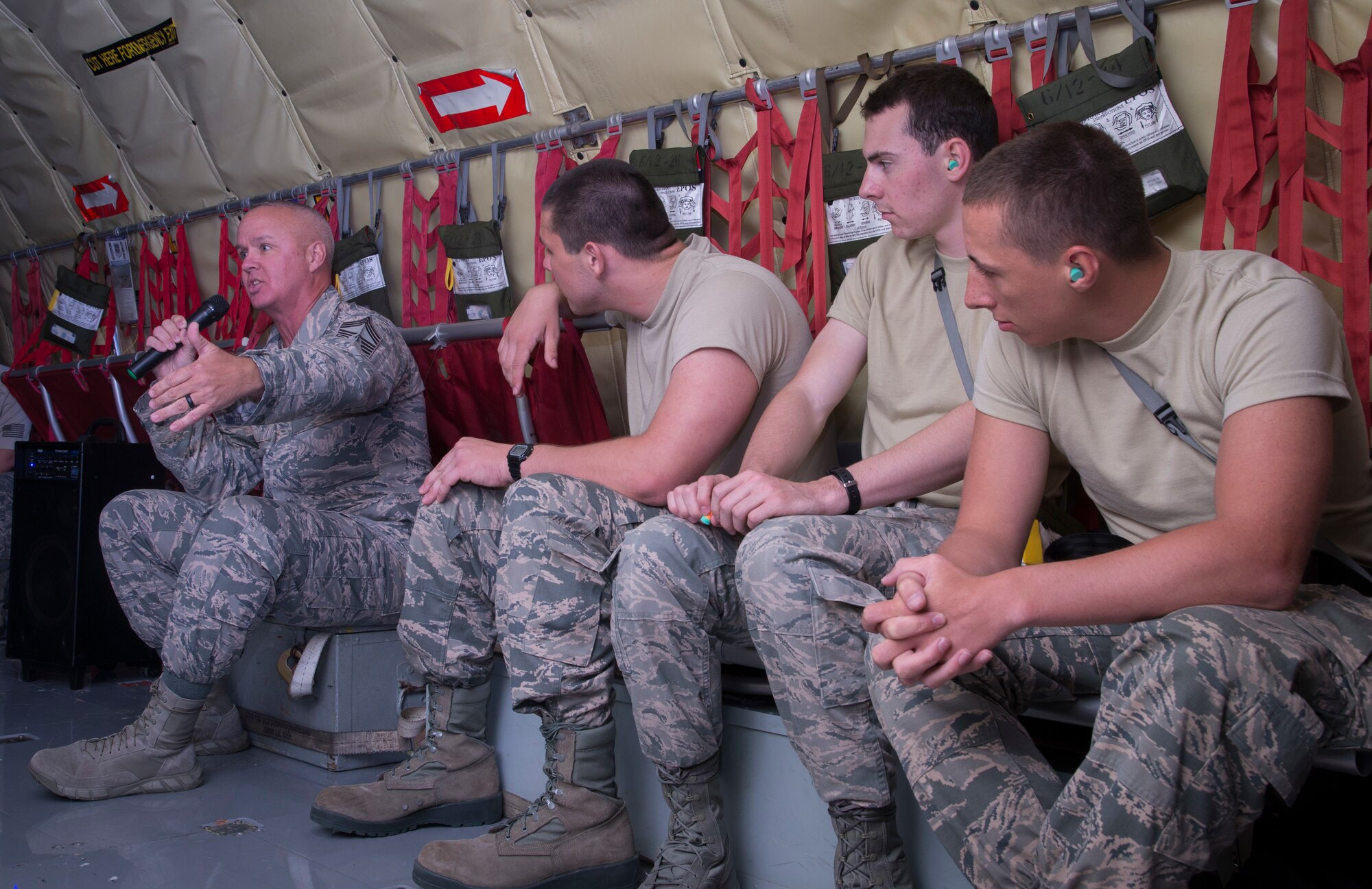 U.S. Air Force Chief Master Sgt. Michael Lemond, the superintendent assigned to the 6th Mission Support Group, briefs Reserve Officer Training Corps (ROTC) cadets during a KC-135 Stratotanker aircraft incentive flight June 14, 2018, over the Eastern United States.