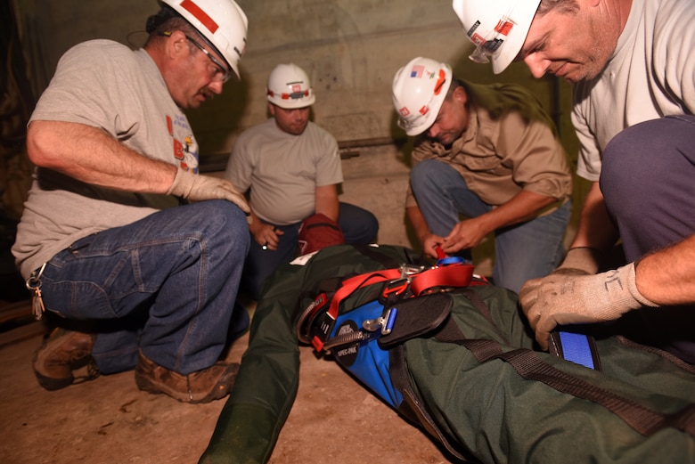 Employees at Old Hickory Hydropower Plant take part in a simulated exercise to extract a training dummy from a confined space during a Confined Space and Confined Space Rescue Course June 14, 2018 in Hendersonville, Tenn. The U.S. Army Corps of Engineers Nashville District trained 32 employees to lead the in-house training in March 2017, which will benefit more than 200 employees across the district who require the annual training. (USACE photo by Lee Roberts)