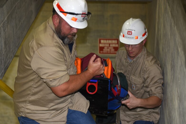 Employees at Old Hickory Hydropower Plant take part in a simulated exercise to extract a training dummy from a confined space during a Confined Space and Confined Space Rescue Course June 14, 2018 in Hendersonville, Tenn. The U.S. Army Corps of Engineers Nashville District trained 32 employees to lead the in-house training in March 2017, which will benefit more than 200 employees across the district who require the annual training. (USACE photo by Lee Roberts)