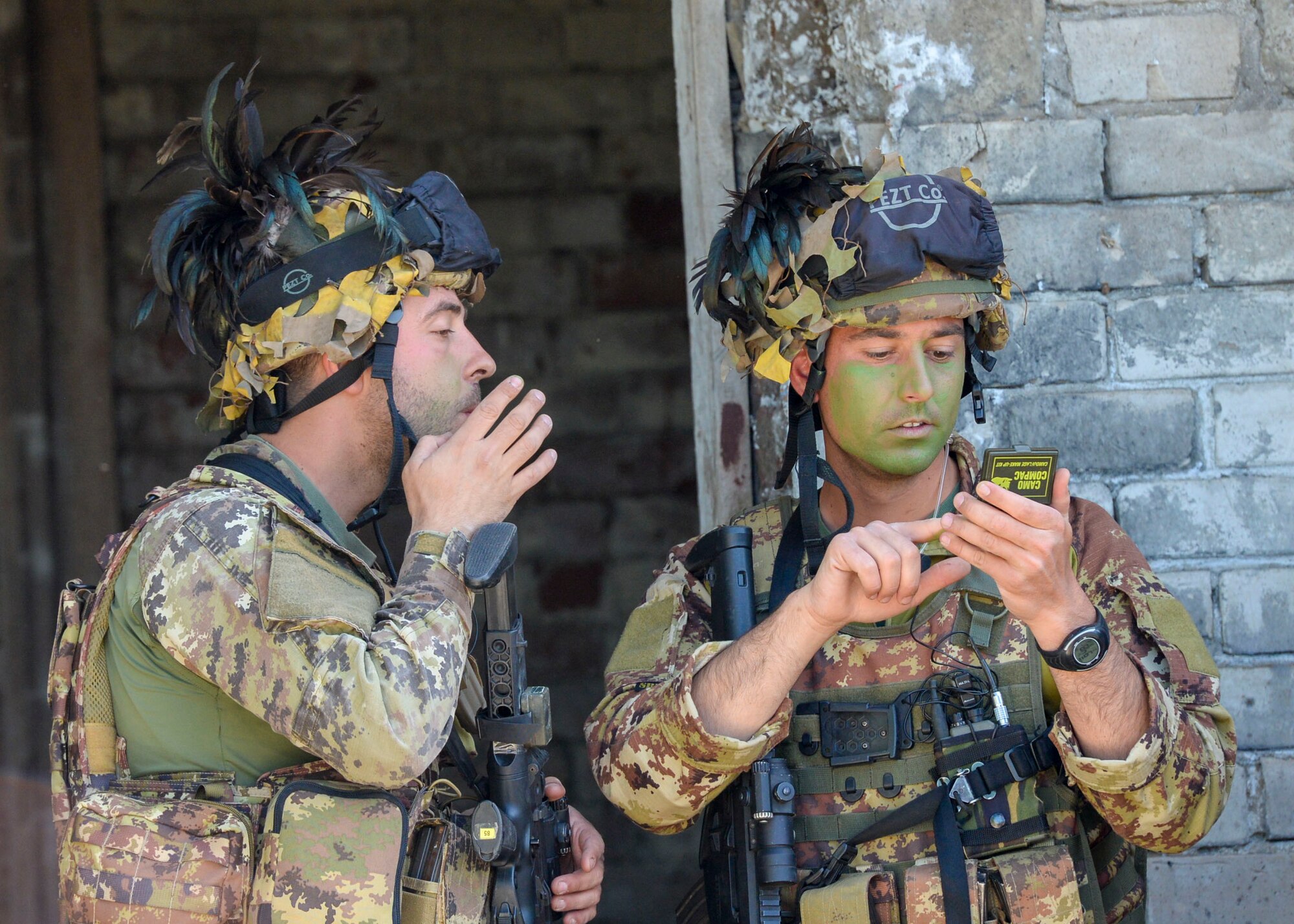 Italian Forces apply camouflage before a large scale exercise in Skrunda, Latvia on June 13, 2018. The exercise was a part of Saber Strike 18 and featured a defending force comprised of Spanish, Italian, Canadian and Latvian Platoons; and an attacking force comprised of U.S. Marines, United Kingdom Royal Marines, Michigan Army National Guard, and Norwegian Forces. Saber Strike 18 is the eighth iteration of the long-standing U.S. Army Europe-led cooperative training exercise enhancing interoperability among allies and regional partners. (U.S. Air Force photo by Staff Sgt. Jimmie D. Pike)