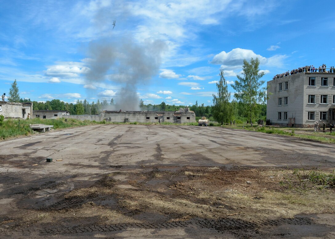 A U.S. Air Force A-10 Thunderbolt II flies by and “drops ordinance” during a large scale battle scenario in Skrunda, Latvia on June 13, 2018. The battle was part of Saber Strike 18 and pieced together communication, tactics, and other facets of military operation into one scenario. More than 150 total sorties were flown during Saber Strike to help build communication and partnership between air units and ground units of participating nations. (U.S. Air Force photo by Staff Sgt. Jimmie D. Pike)