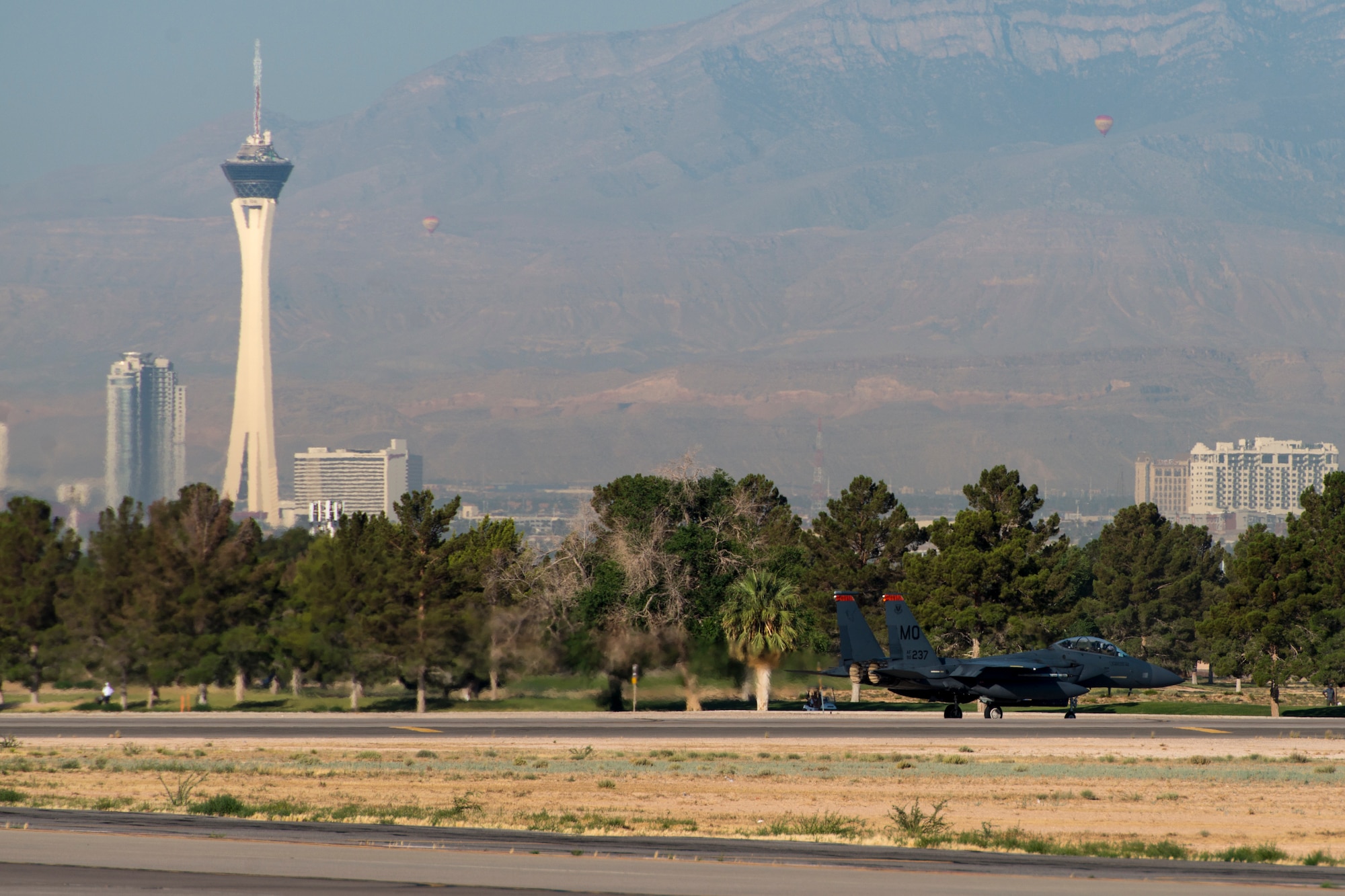 An image of an 391st Fighter Squadron F-15E Strike Eagle taxies to the runway during Green Flag West, June 13, 2018, at Nellis Air Force Base, Nevada. The 391st FS participated in Green Flag to further enhance readiness by training on Close Air Support over the National Training Center, Fort Irwin, California. (U.S. Air Force Photo by Airman 1st Class JaNae Capuno)