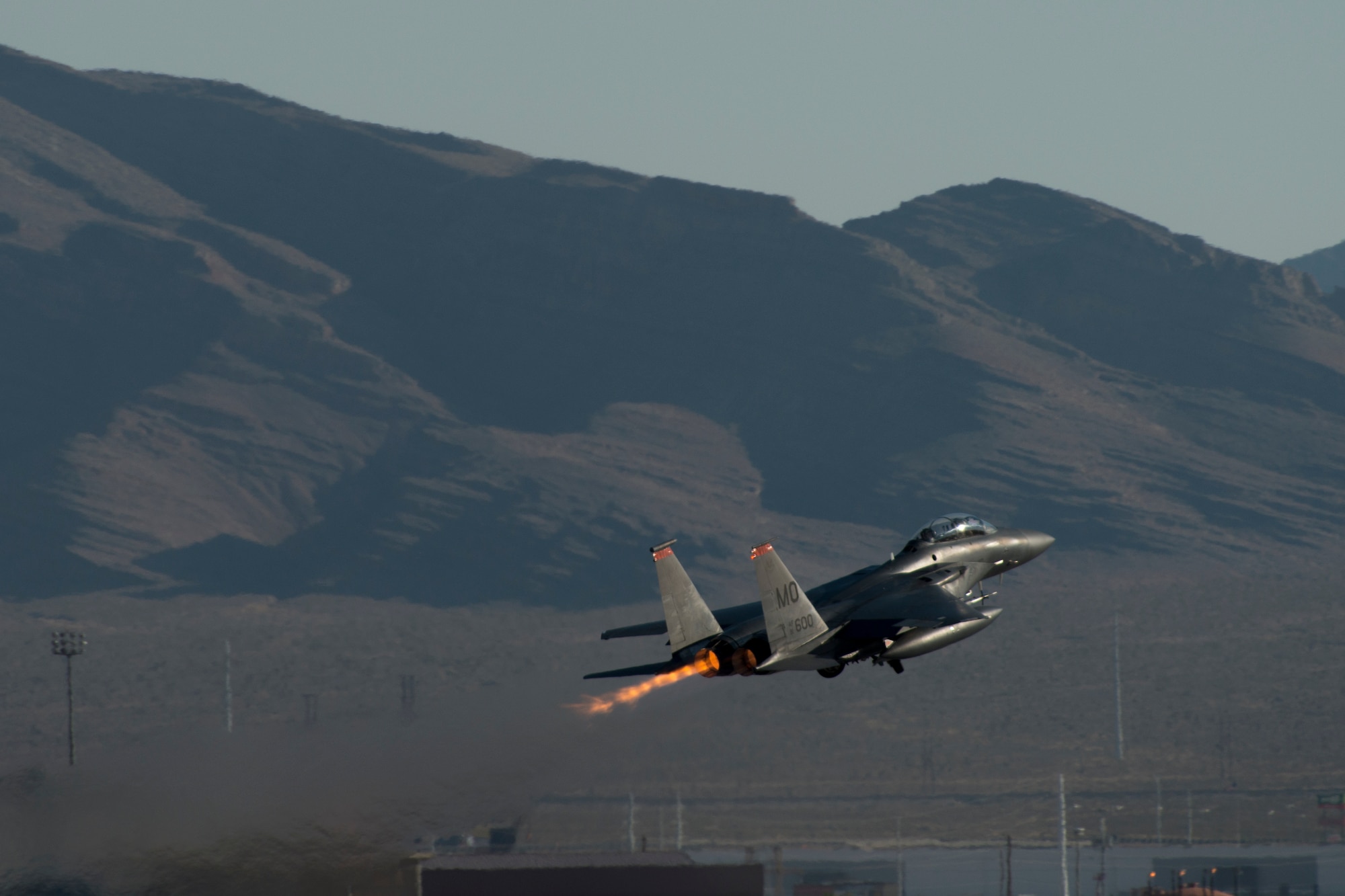 An image of a 391st Fighter Squadron F-15E Strike Eagle takes off during Green Flag West, June 13, 2018, at Nellis Air Force Base, Nevada. The 391st FS participated in Green Flag to further enhance readiness by training on Close Air Support over the National Training Center, Fort Irwin, California. (U.S. Air Force Photo by Airman 1st Class JaNae Capuno)