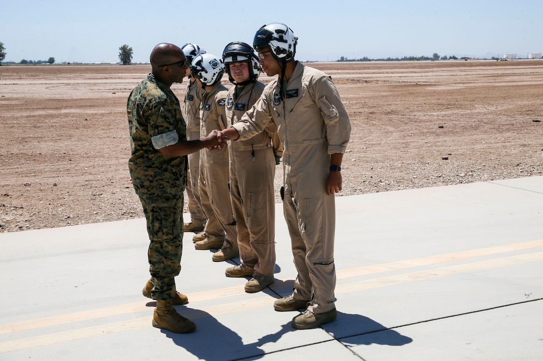 Sgt. Maj. Ronald Green, left, the sergeant major of the Marine Corps, greets Marines with Marine Aerial Refueler Transport Squadron (VMGR) 352, 3rd Marine Aircraft Wing, prior to the squadron providing air-delivered ground refuel services to fixed wing aircraft at Naval Air Facility El Centro, Calif., June 9. VMGR-352 is conducting their deployment training at various bases in Southern California and at Kirtland Air Force Base in Albuquerque, N.M., to give Marines real-time preparation for potential missions their squadron might perform in a forward-deployed scenario. (U.S. Marine Corps photo by Sgt. David Bickel/Released)