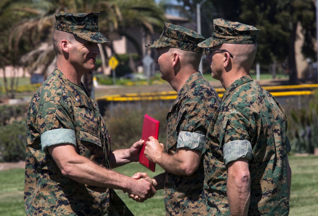 Lt. Col. Michael E. Sheridan, former commanding officer of Marine Wing Communications Squadron (MWCS) 48, receives a Meritorious Service Medal during his change of command ceremony at Marine Corps Air Station Miramar, Calif., June 13. Lt. Col. Brian C. Pate assumed command of MWCS-48 from Sheridan, who was in command for approximately two years. (U.S. Marine Corps photo by Cpl. Becky Cleveland/Released)