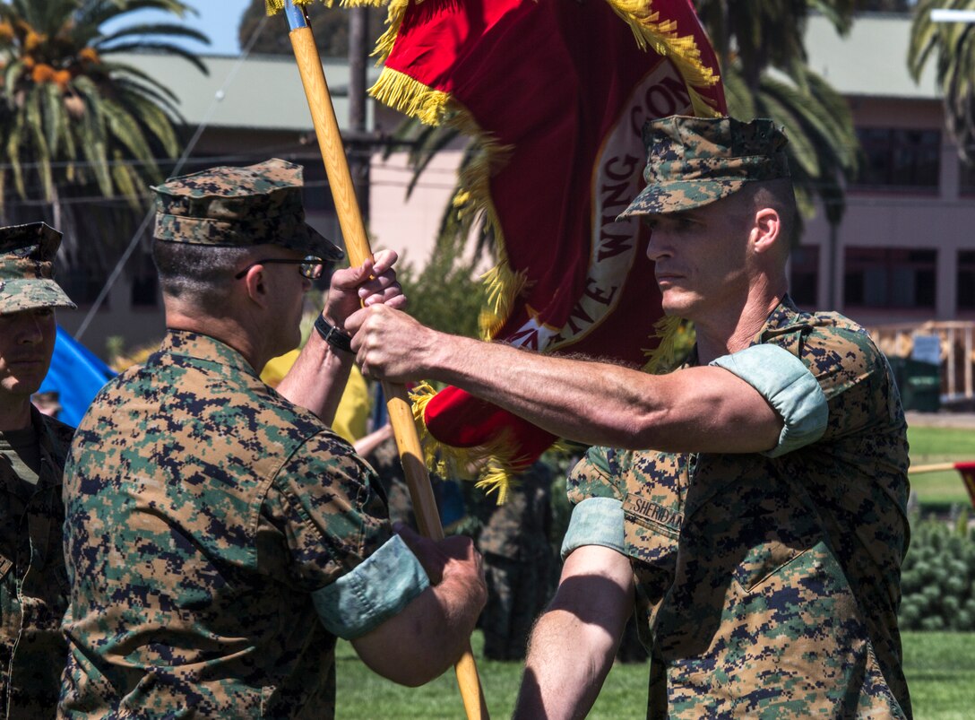 Lt. Col. Michael E. Sheridan former commanding officer of Marine Wing Communications Squadron (MWCS) 48, passes the command’s colors to Lt. Col. Brian C. Pate, commanding officer of MWCS-48, during their change of command ceremony at Marine Corps Air Station Miramar, Calif., June 13. Pate assumed command of MWCS-48 from Sheridan, who was in command for approximately two years and received a Meritorious Service Medal for his time with MWCS-48. (U.S. Marine Corps photo by Cpl. Becky Cleveland/Released)
