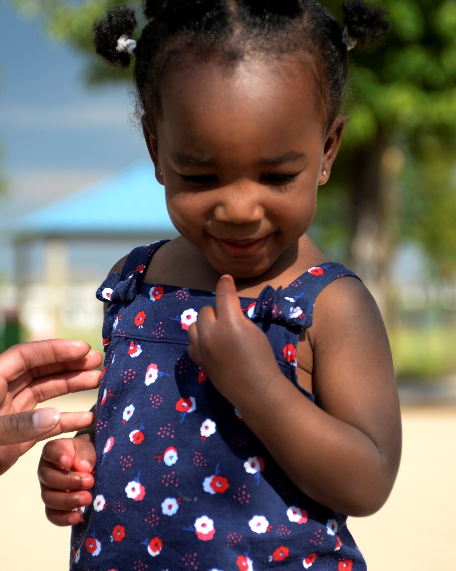 Jayla Mitchell wears red, white and blue in observance of Flag Day at Ellsworth’s Child Development Center’s Flag Day Picnic.  Ellsworth Child Development Center celebrated the national observance during their Eighth Annual Flag Day Picnic. (U.S. Air Force photo by Senior Airman Michella Stowers)