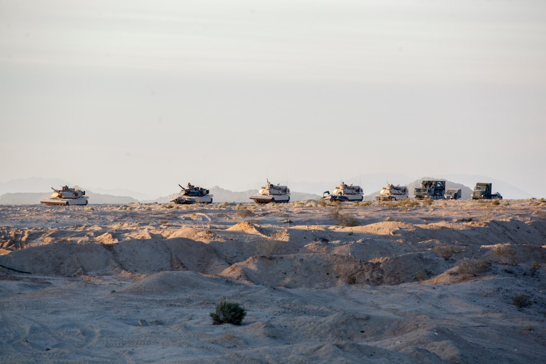 Marines with Alpha Company, 4th Combat Engineer Battalion, 4th Marine Division, arrive at Training Area Delta for an obstacle clearing detachment practical application, during Integrated Training Exercise 4-18, aboard Marine Corps Air Ground Combat Center Twentynine Palms, California, June 12, 2018. The OCD training was conducted to prepare Marines for the execution of a live-fire combined arms breach in which mechanized units will detonate a 1,000 pound mine clearing charge.