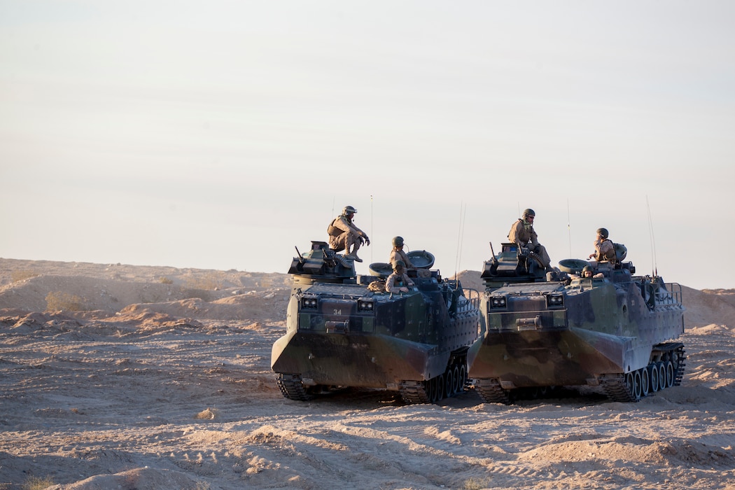 Marines with Delta Company, 4th Assault Amphibious Vehicle Battalion, 4th Marine Division, stage their assault amphibious vehicles for an obstacle clearing detachment practical application during Integrated Training Exercise 4-18, aboard Marine Corps Air Ground Combat Center Twentynine Palms, California, June 12, 2018. The OCD training was conducted to prepare Marines for the execution of a live-fire combined arms breach in which mechanized units will detonate a 1,000 pound mine clearing charge.