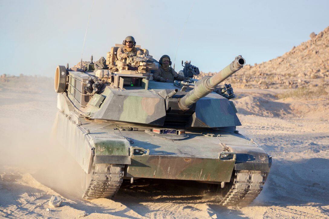 Marines with Echo Company, 4th Tank Battalion, 4th Marine Division, reposition their M1A1 Abrams main battle tank for an obstacle clearing detachment practical application during Integrated Training Exercise 4-18, aboard Marine Corps Air Ground Combat Center Twentynine Palms, California, June 12, 2018. The OCD training was conducted to prepare Marines for the execution of a live-fire combined arms breach in which mechanized units will detonate a 1,000 pound mine clearing charge.