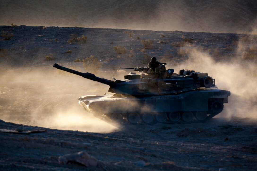 Marines with Echo Company, 4th Tank Battalion, 4th Marine Division, stage their M1A1 Abrams main battle tank for an obstacle clearing detachment practical application during Integrated Training Exercise 4-18, aboard Marine Corps Air Ground Combat Center Twentynine Palms, California, June 12, 2018. The OCD training was conducted to prepare Marines for the execution of a live-fire combined arms breach in which mechanized units will detonate a 1,000 pound mine clearing charge.