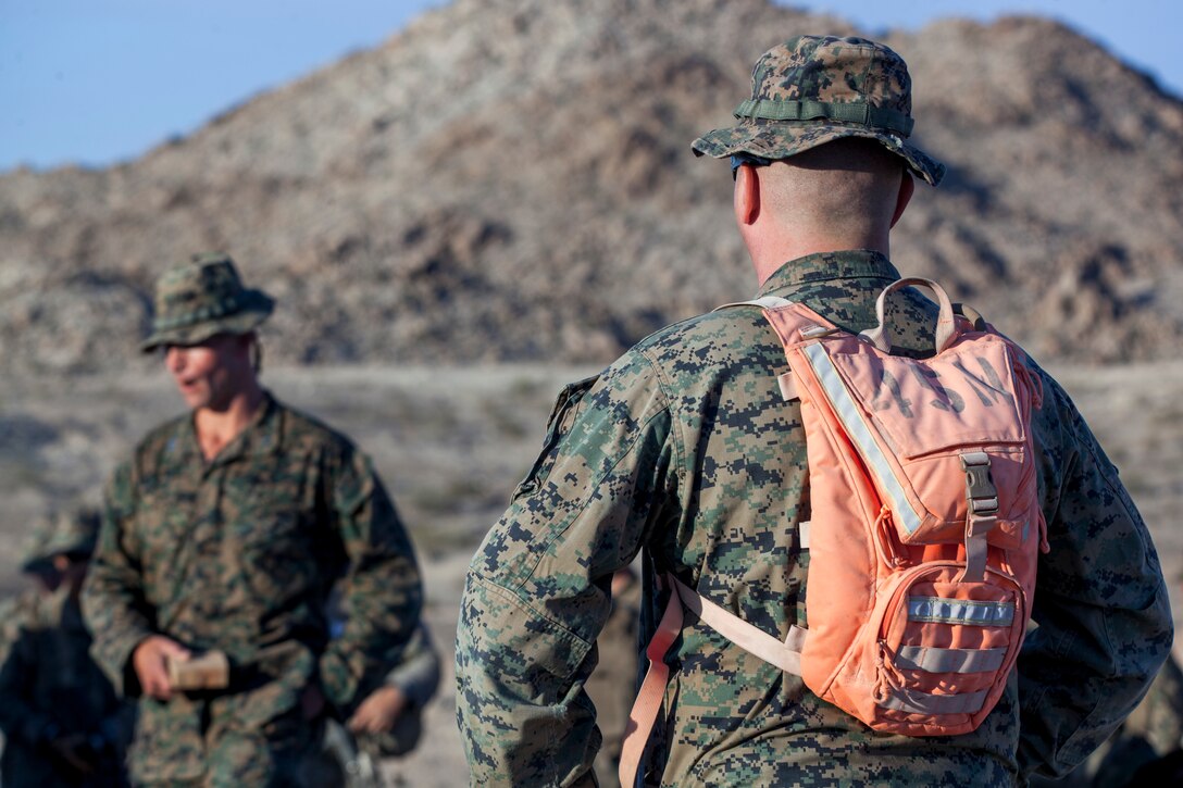 Coyote instructors with Tactical Training Exercise Control Group, Marine Air Ground Task Force Training Command, brief Marines of Alpha Company, 4th Combat Engineer Battalion, 4th Marine Division, on the obstacle clearing detachment practical application, during Integrated Training Exercise 4-18, aboard Marine Corps Air Ground Combat Center, Twentynine Palms, California, June 12, 2018. The OCD training was conducted to prepare Marines for the execution of a live-fire combined arms breach in which mechanized units will detonate a 1,000 pound mine clearing charge.