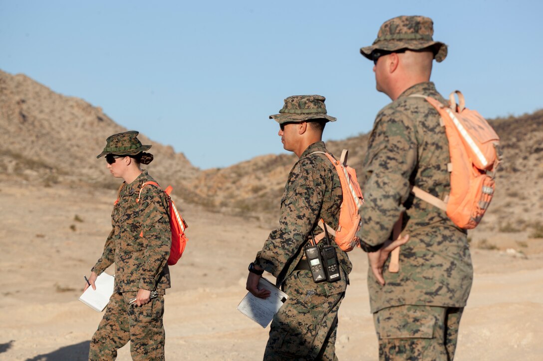 Coyote Trainers with Tactical Training Exercise Control Group, Marine Air Ground Task Force Training Command, brief Marines with 4th Combat Engineer Battalion, 4th Marine Division, 4th Tank Battalion, 4th MarDiv, and 4th Assault Amphibious Battalion, 4th MarDiv, before an obstacle clearing detachment practical application, during Integrated Training Exercise 4-18, aboard Marine Corps Air Ground Combat Center Twentynine Palms, California, June 12, 2018. The OCD training was conducted to prepare Marines for the execution of a live-fire combined arms breach in which mechanized units will detonate a 1,000 pound mine clearing charge.