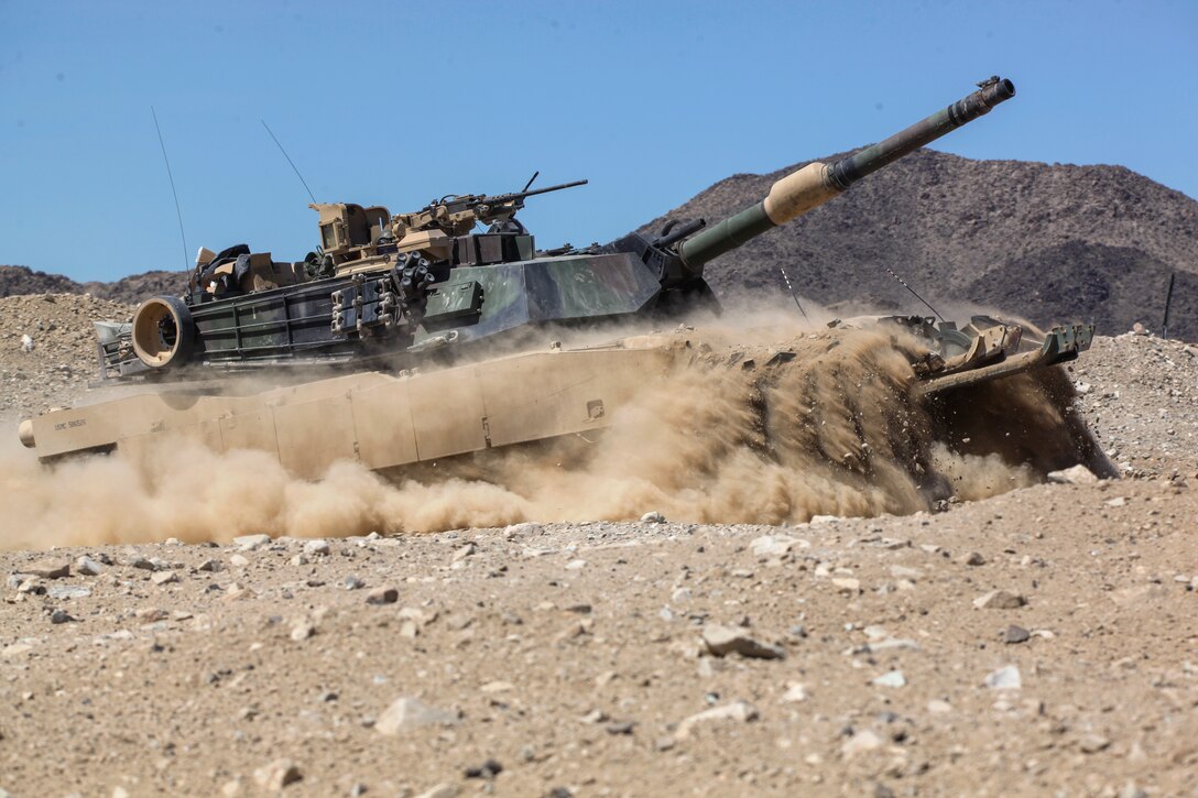 Marines with Echo Company, 4th Tank Battalion, 4th Marine Division, clear an obstacle with an M1A1 Abrams main battle tank, during an obstacle clearing detachment practical application, during Integrated Training Exercise 4-18, aboard Marine Corps Air Ground Combat Center Twentynine Palms, California, June 12, 2018. The OCD training was conducted to prepare Marines for the execution of a live-fire combined arms breach in which mechanized units will detonate a 1,000 pound mine clearing charge.