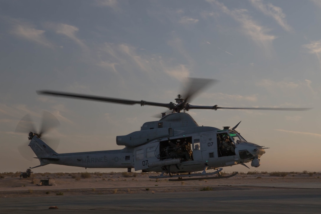 Marines with Marine Light Attack Helicopter Squadron 775, Marine Aircraft Group-41, 4th Marine Aircraft Wing, take off in a UH-1Y Venom for night operations during Integrated Training Exercise 4-18 at Marine Corps Air Ground Combat Center Twentynine Palms, California, June 12, 2018. HMLA-775, also known as the “Coyotes”, provides air combat element support to Marine Air Ground Task Force 23 during ITX 4-18.  (U.S. Marine Corps photo by Lance Cpl. Samantha Schwoch/released